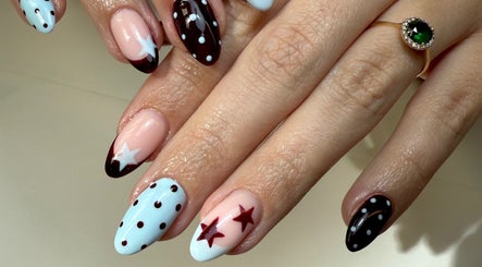 Elegant nail art with stars at Gels by Maria, Manchester, England, GB.