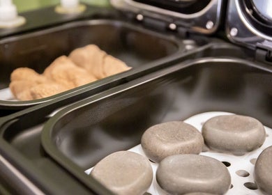 Hot stones at Kimyra Thai Massage & Spa in Waltham Abbey, England, GB for a revitalizing massage experience.