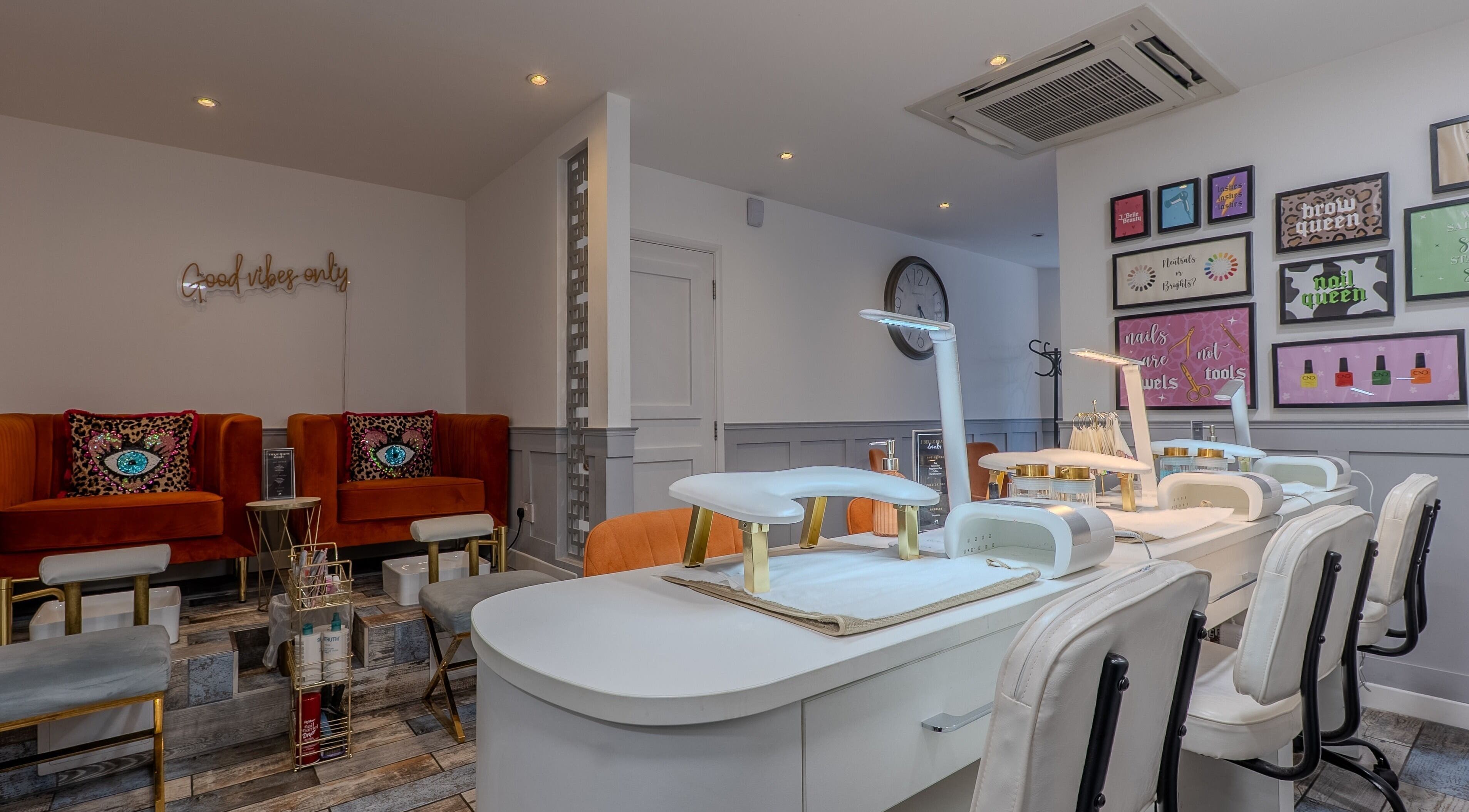 Elegant nail care station at J Belle Beauty in Bromley, England, GB, showcasing modern decor and seating.