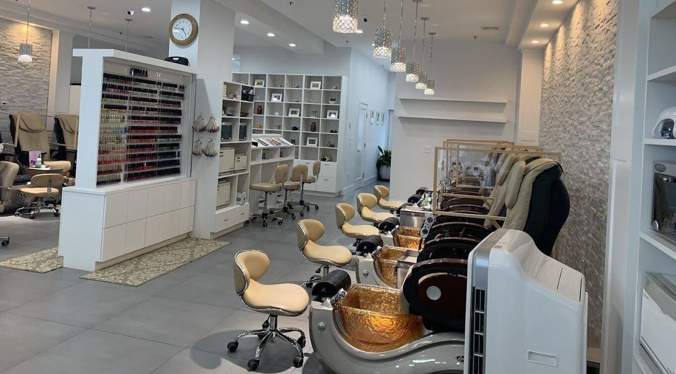 Chic interior of Abloom Nail & Spa in Yorktown Heights, New York, US, featuring luxurious spa chairs and nail polish display.