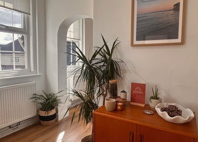 Inviting interior at Mantra in Leeds, England featuring plants and serene decor under natural light.
