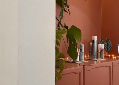 Mantra beauty setting with products, plants, and soft lighting in Leeds, England, GB.
