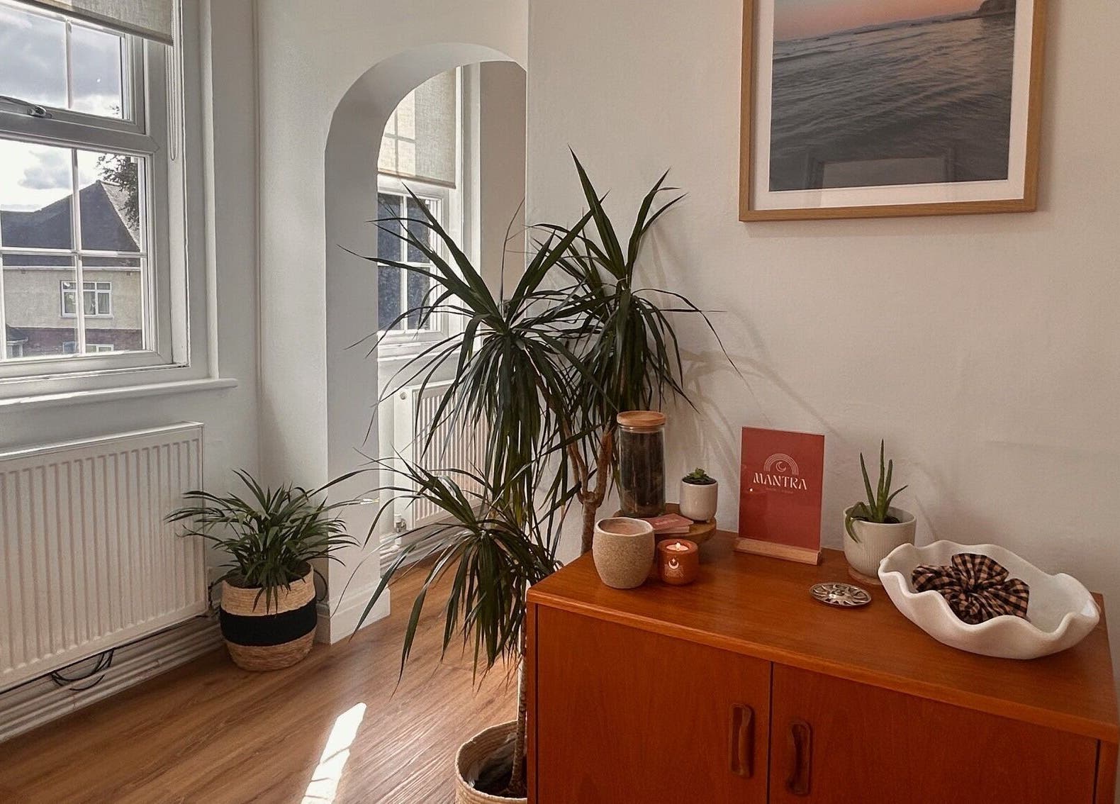 Cozy interior of Mantra Studio in Leeds, England, GB, featuring plants and warm natural light.