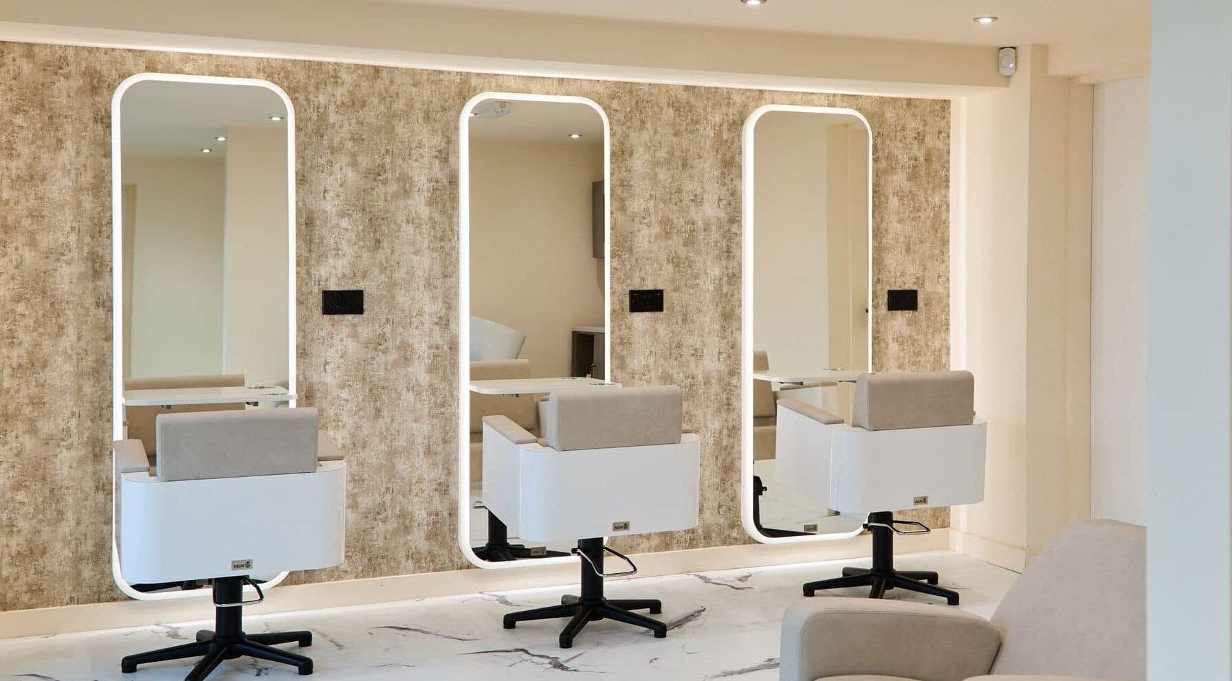Chic salon interior at Alysia Grimshaw Hair in Ramsbottom, England, GB, featuring stylish mirrors and seating.
