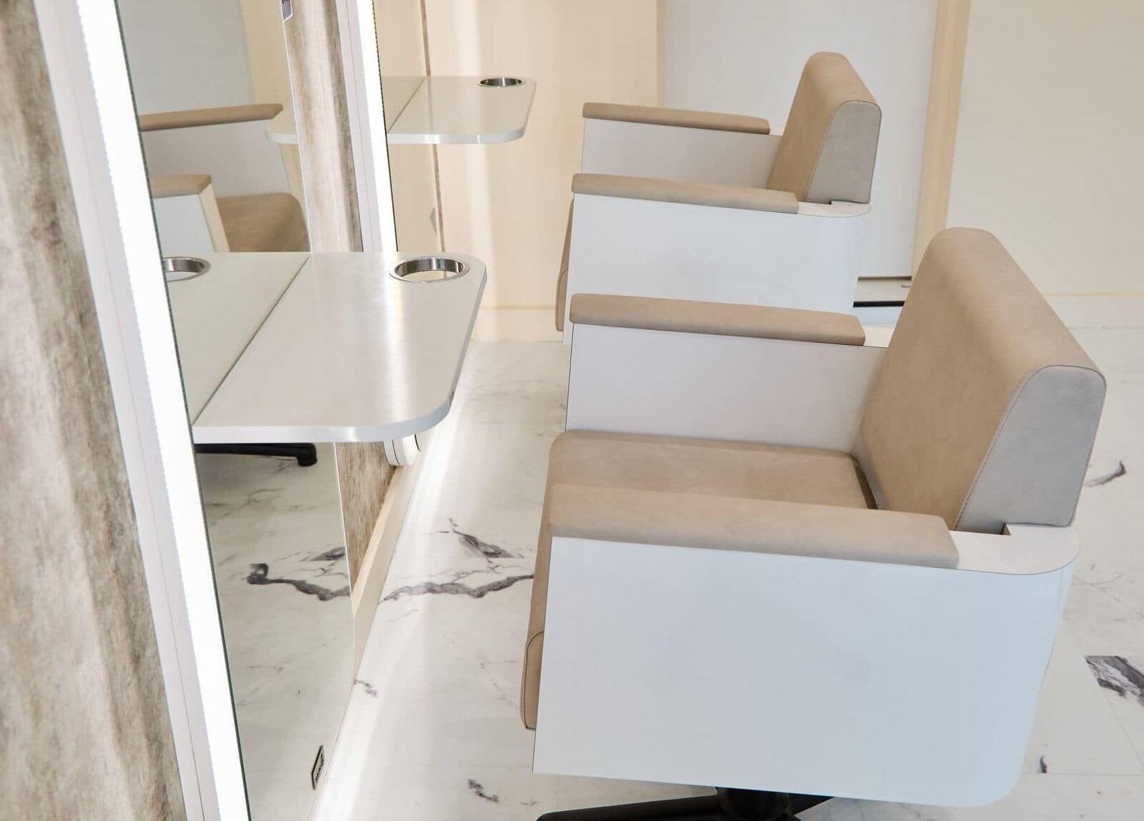 Modern salon chairs at Alysia Grimshaw Hair in Ramsbottom, England, GB featuring sleek design.