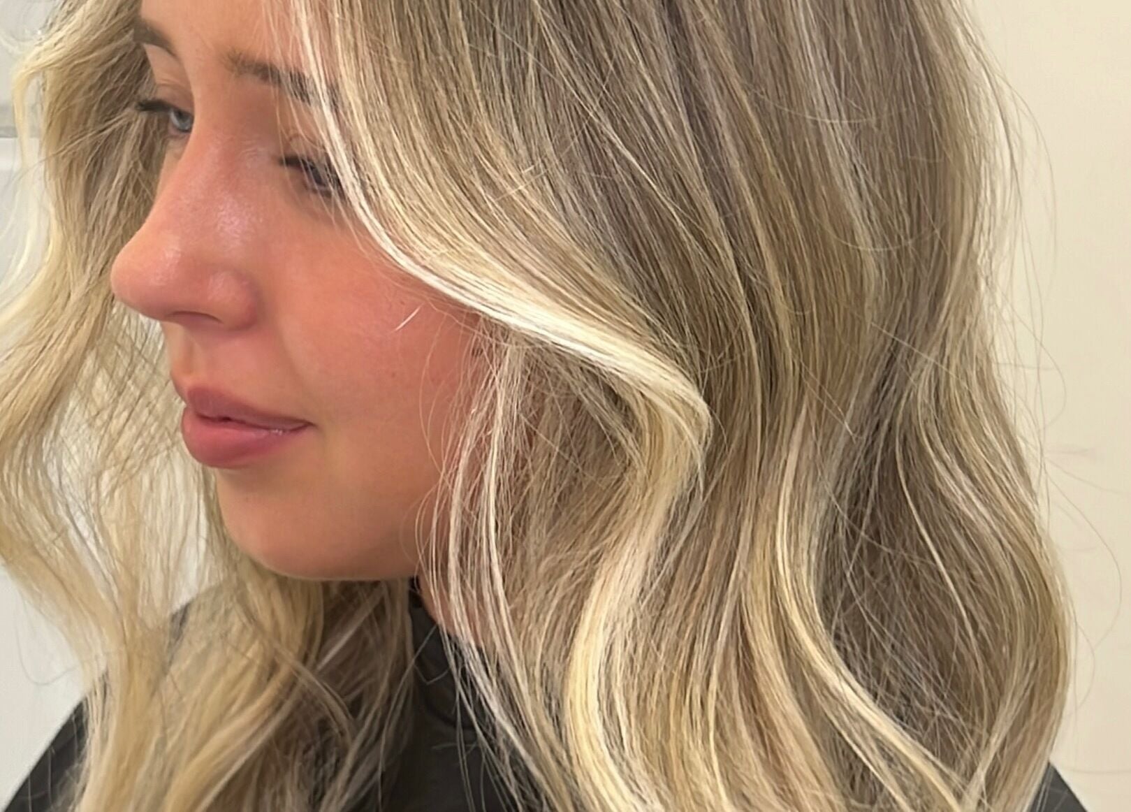 Soft blonde waves styled at Alysia Grimshaw Hair in Ramsbottom, England, GB for a radiant look.