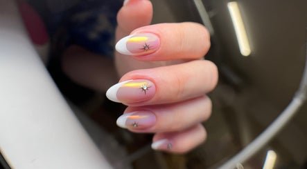 Stylish manicured nails with star accents at ZnailsChicago in Chicago, Illinois, US.