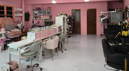 Inside Magnifique By Paris Jane - Balestier, a chic salon in Singapore, SG with elegant pink decor and plush seating.