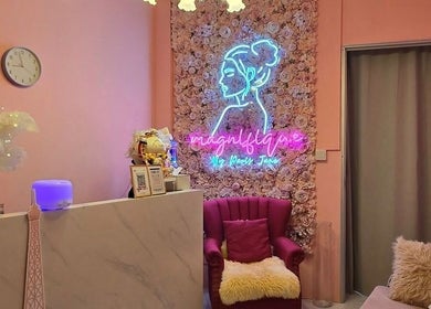 Stylish lounge at Magnifique By Paris Jane - Ang Mo Kio, Singapore, Singapore, SG, featuring chic decor and neon art.
