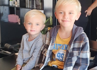 Children happily sitting at Y & Co. SKIN - HAIR - NAILS in Yzerfontein, Western Cape, ZA.