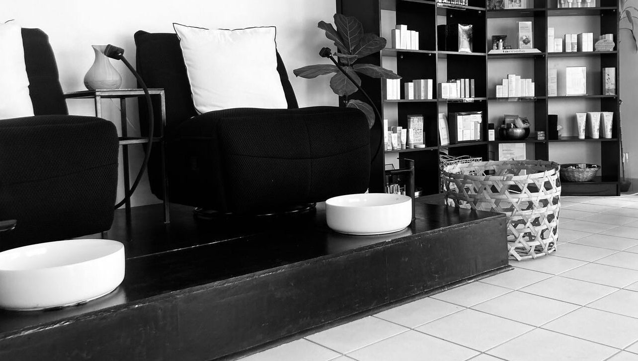 Elegant lounge area at Y & Co. SKIN - HAIR - NAILS in Yzerfontein, Western Cape, ZA with stylish decor.