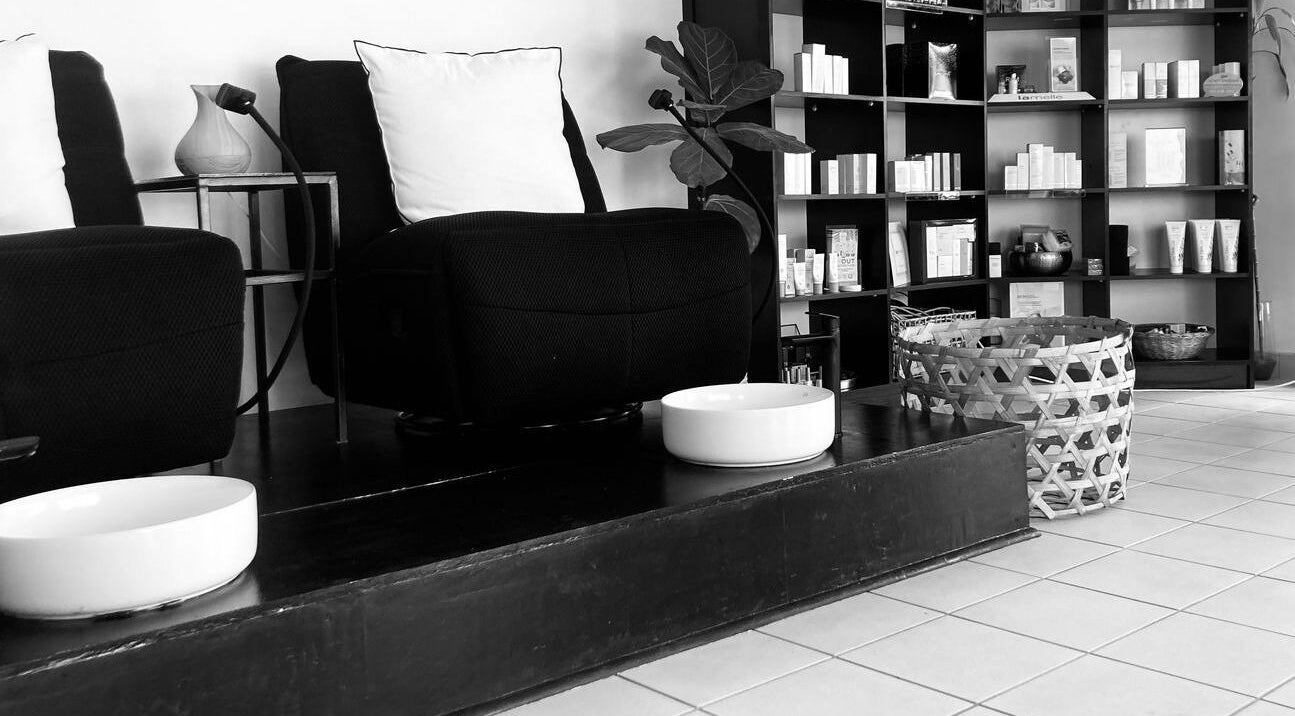 Elegant lounge area at Y & Co. SKIN - HAIR - NAILS in Yzerfontein, Western Cape, ZA with stylish decor.