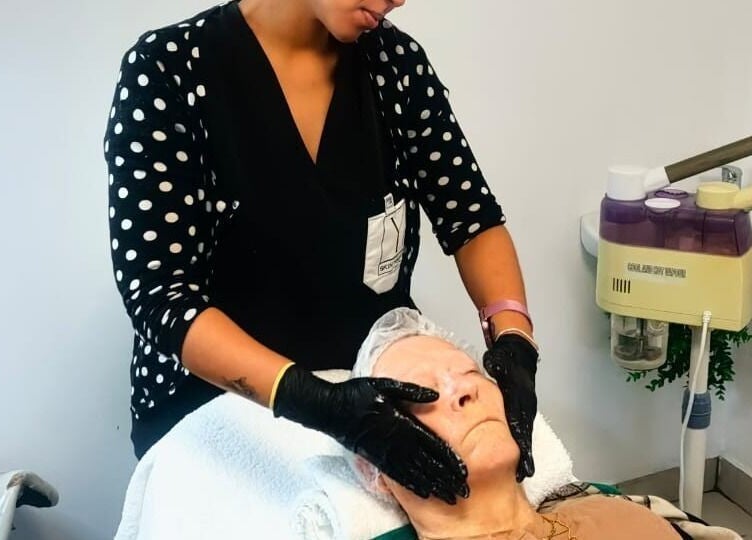 Beauty therapist providing facial treatment at Y & Co. SKIN - HAIR - NAILS, Yzerfontein, Western Cape, ZA.