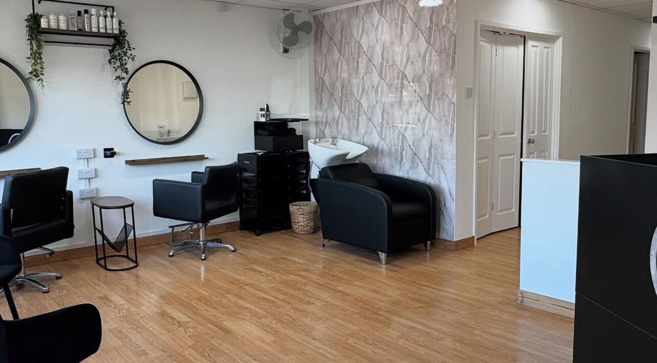 Modern interior of Flicks Hair Studio in Fareham, England, GB featuring stylish chairs and mirrors.