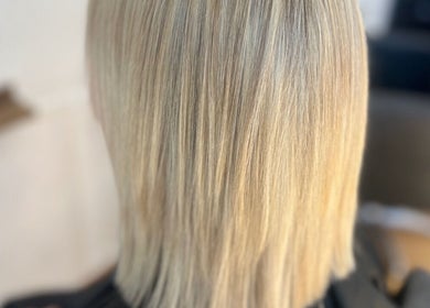 Blonde hair styled at Flicks Hair Studio, Fareham, England, GB, showcasing sleek, smooth texture.