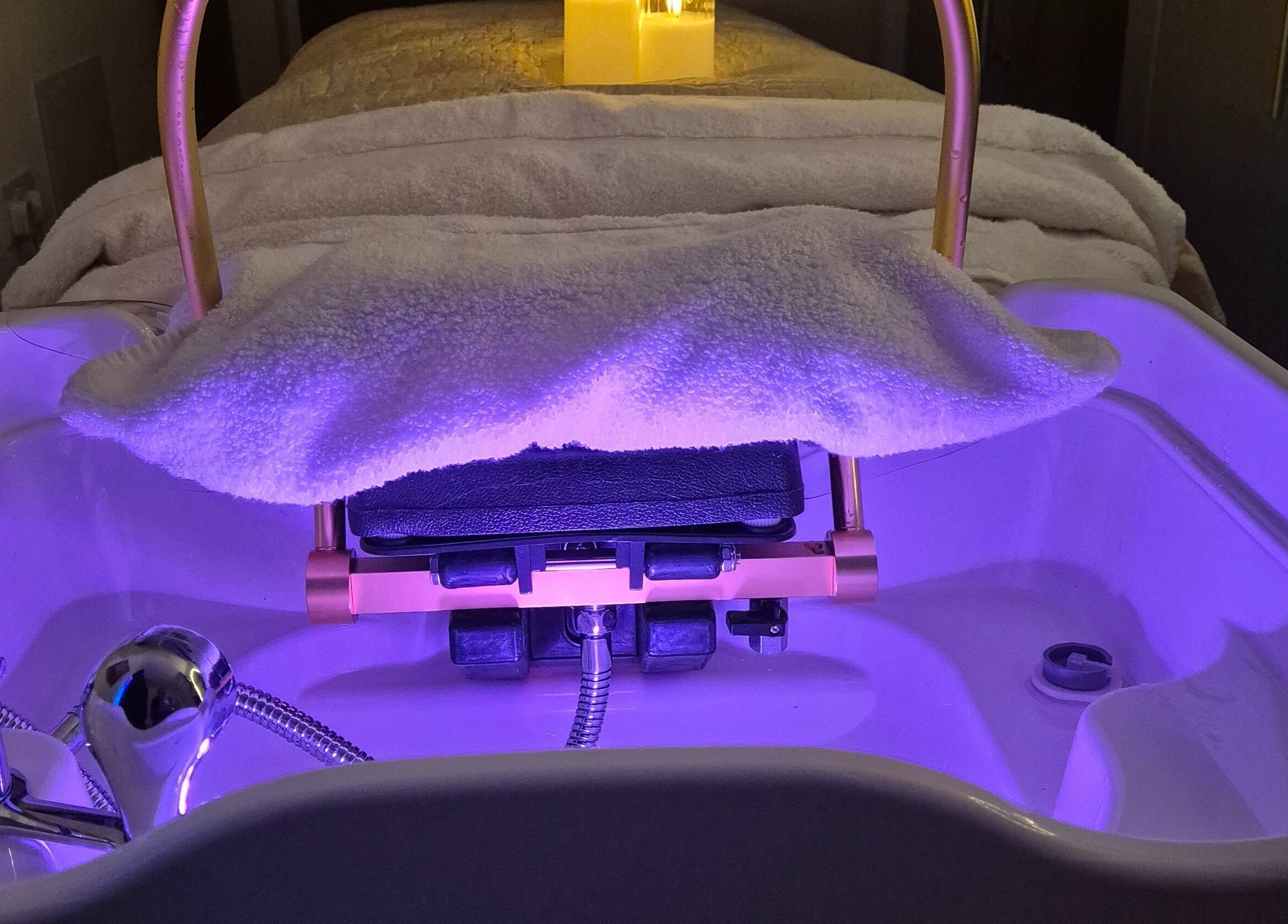 Relaxing head spa basin at Japanese head spa by Lucy Butterly, Horsham, England, GB, glows with ambient lighting.