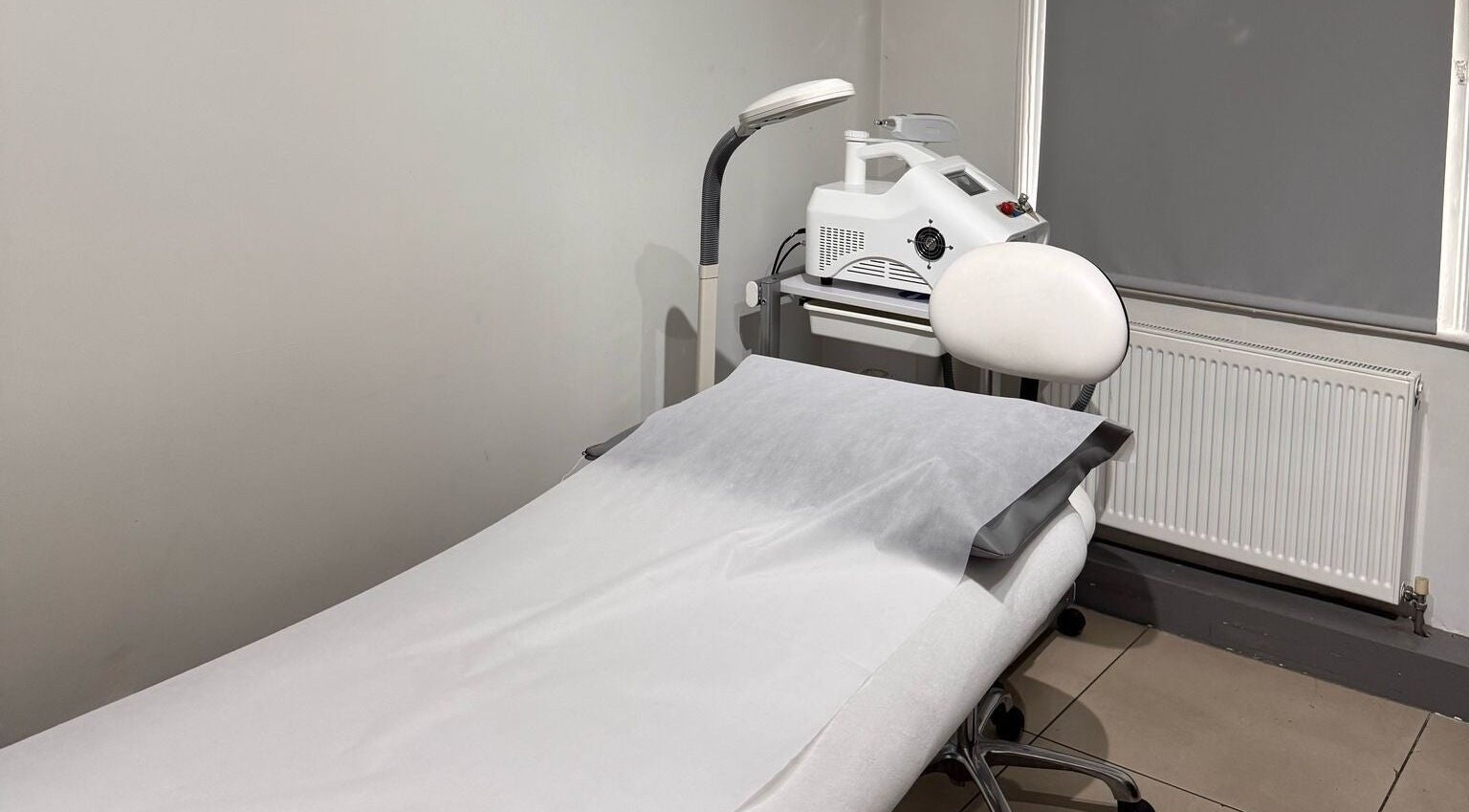 Treatment room at The Chelmsford Skin Clinic, Chelmsford, England, GB, showcasing professional spa equipment.