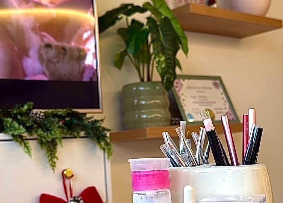 The Pixie Studio in Cardiff, Wales, GB showcases stylish decor with beauty tools on display and vibrant greenery.