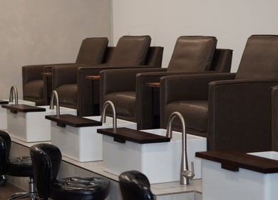 Luxurious pedicure lounge at Brand & Co. in Philadelphia, Pennsylvania, US, featuring plush seating.