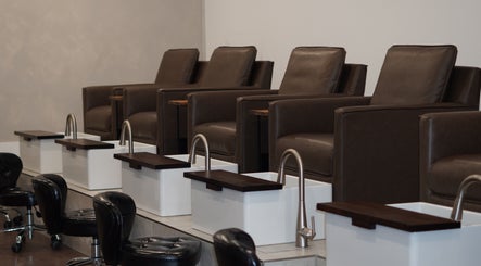 Luxurious pedicure lounge at Brand & Co. in Philadelphia, Pennsylvania, US, featuring plush seating.