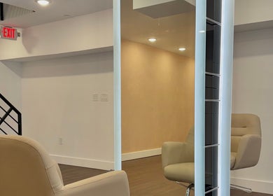 Modern interior of Brand & Co. salon in Philadelphia, Pennsylvania, US featuring sleek design and cozy seating.