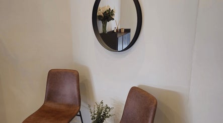 Elegant seating area with mirror at Refined Artistry, Centurion, Gauteng, ZA.