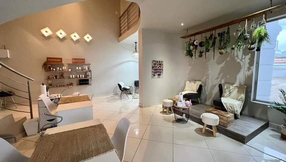 Refined Artistry lounge with cozy seating and greenery in Centurion, Gauteng, ZA.