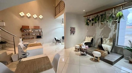 Refined Artistry lounge with cozy seating and greenery in Centurion, Gauteng, ZA.