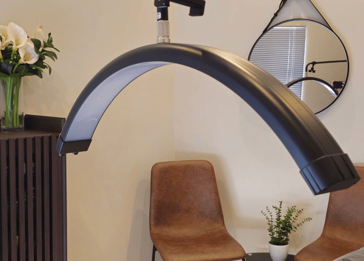 Refined Artistry's tranquil lighting corner in Centurion, Gauteng, ZA, featuring plush chairs and elegant decor.