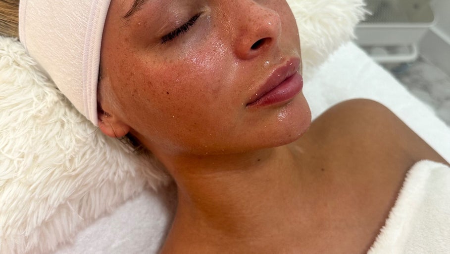 Close-up of a serene woman with glowing skin at taylarmadeskin, Paisley, Scotland, GB spa.