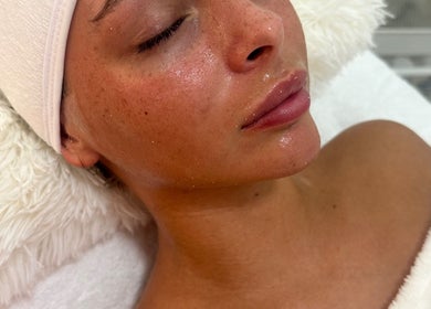 Close-up of a serene woman with glowing skin at taylarmadeskin, Paisley, Scotland, GB spa.