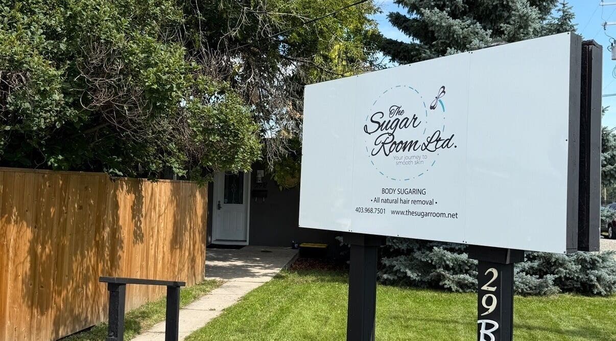 Entrance sign of The Sugar Room Okotoks offering body sugaring in Okotoks, Alberta, CA.