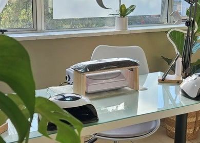 Modern nail station at Sj Studio, Durban, Kwazulu-natal, ZA with manicure tools and lush greenery.