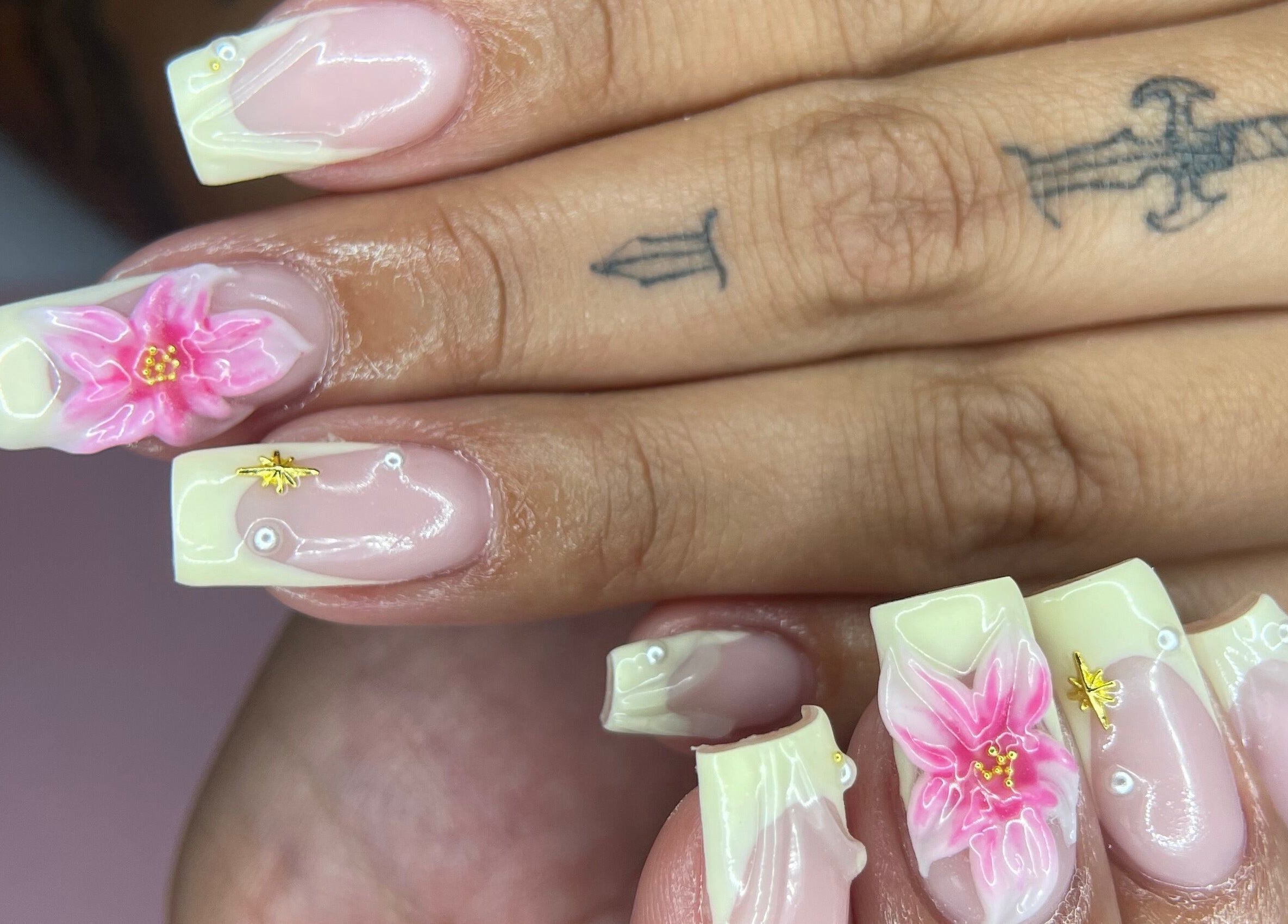 Beautiful floral nail art at studio3esthetics, Thunder Bay, Ontario, CA, showcasing delicate pink petals.