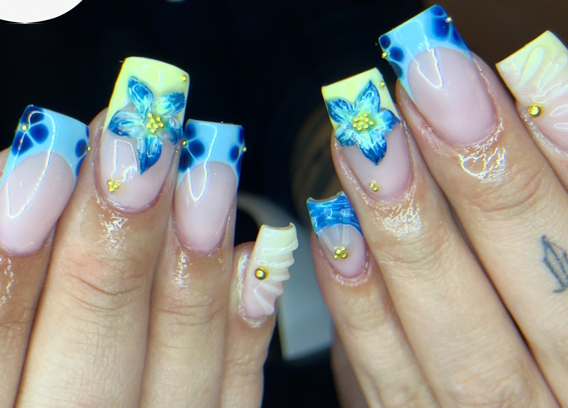 Blue and yellow floral nail art at studio3esthetics, Thunder Bay, Ontario, CA.