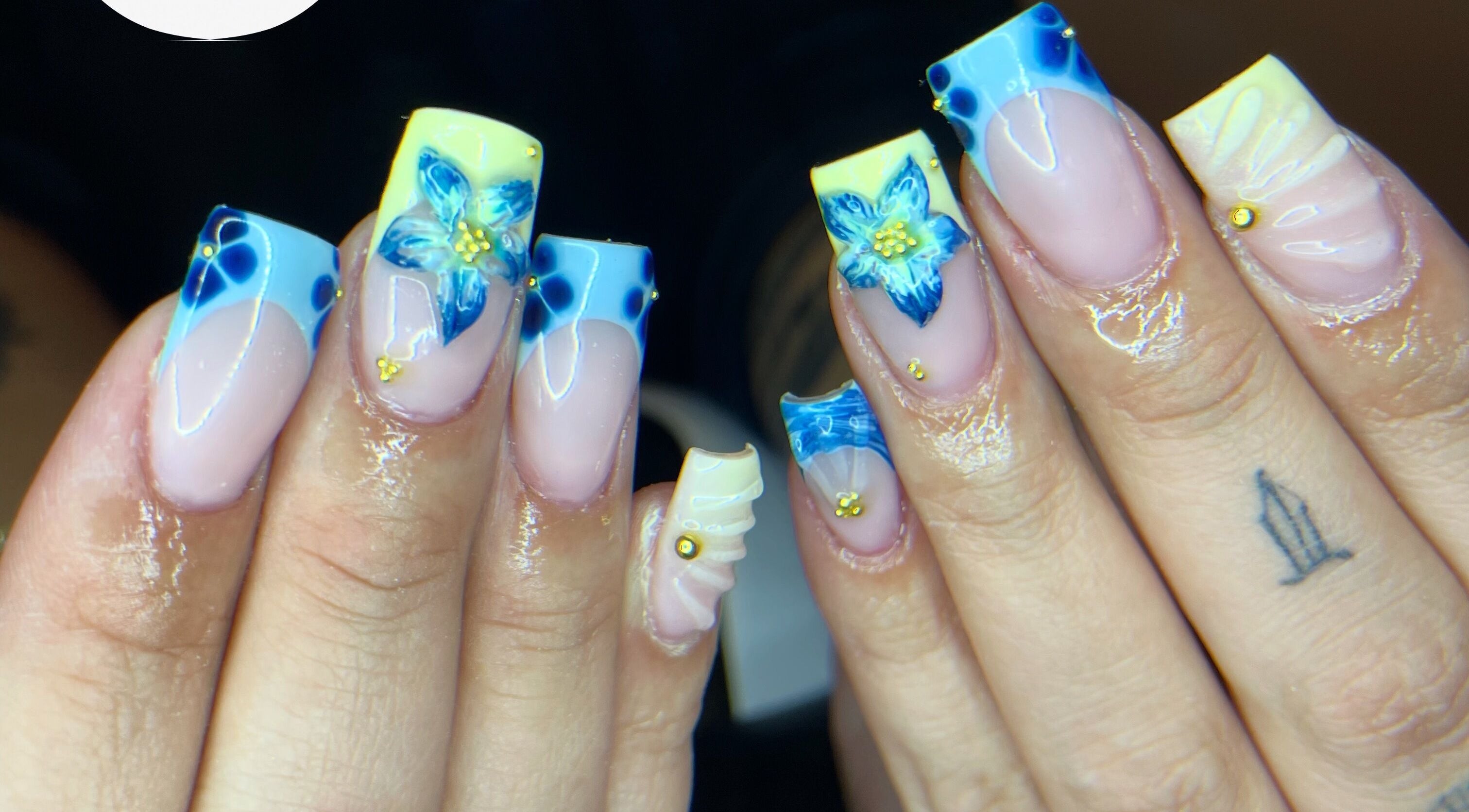 Blue and yellow floral nail art at studio3esthetics, Thunder Bay, Ontario, CA.