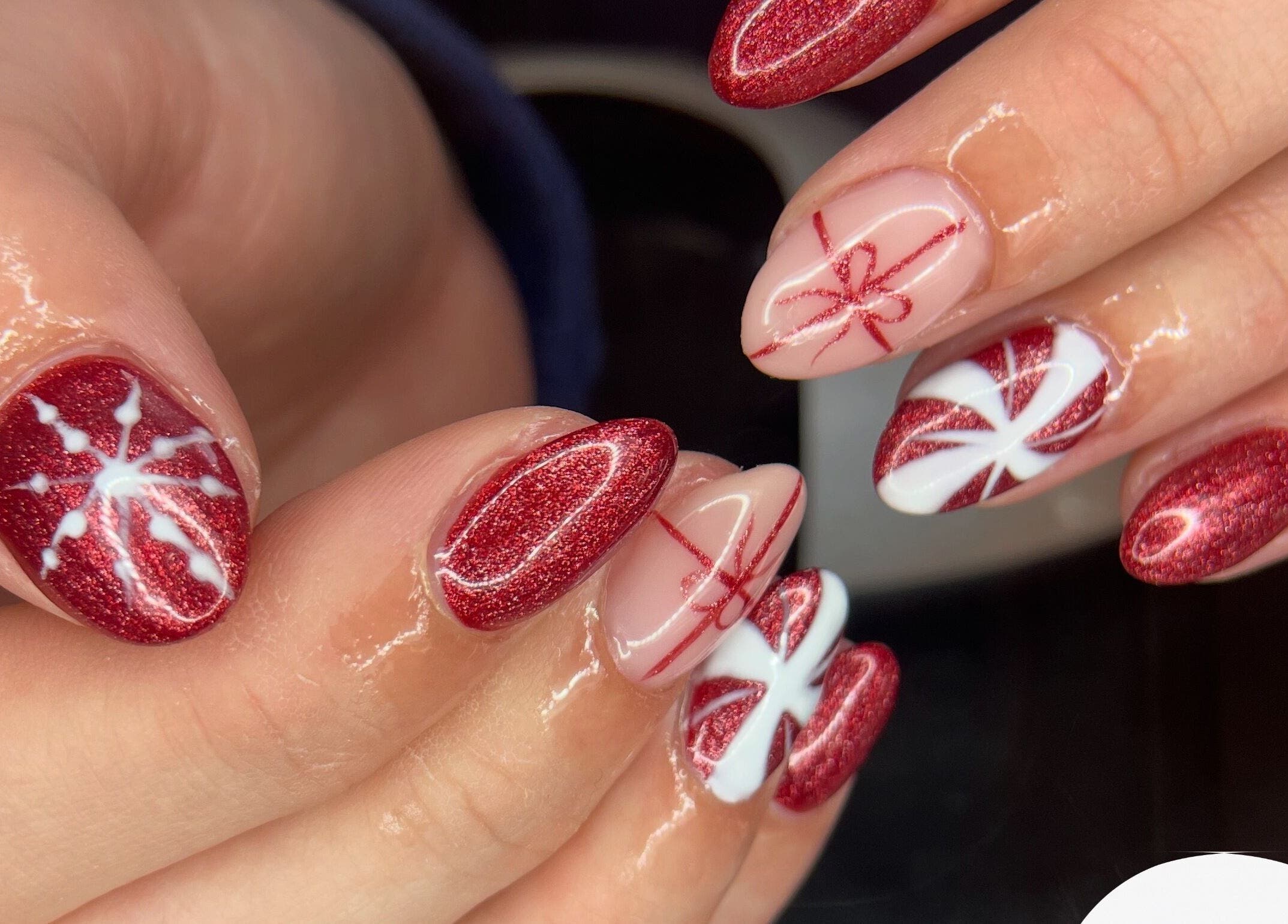 Festive red and white nail art at studio3esthetics in Thunder Bay, Ontario, CA.