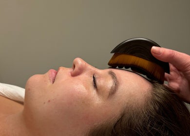 Relaxing facial treatment at Pure Esthetics, Chester, England, GB. A client receives a gentle forehead massage.
