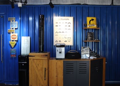 Stylish interior of Brusko Barbers featuring decor and signage in دبي, دبي, AE.