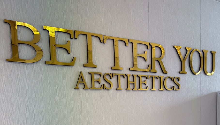 Gold sign of Better You Aesthetics in Finglas, County Dublin, IE on textured wall.