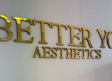 Gold sign of Better You Aesthetics in Finglas, County Dublin, IE on textured wall.
