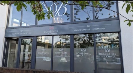 Exterior of Skin&Medics@Bombshell in Basingstoke, England, GB with large windows and logo.