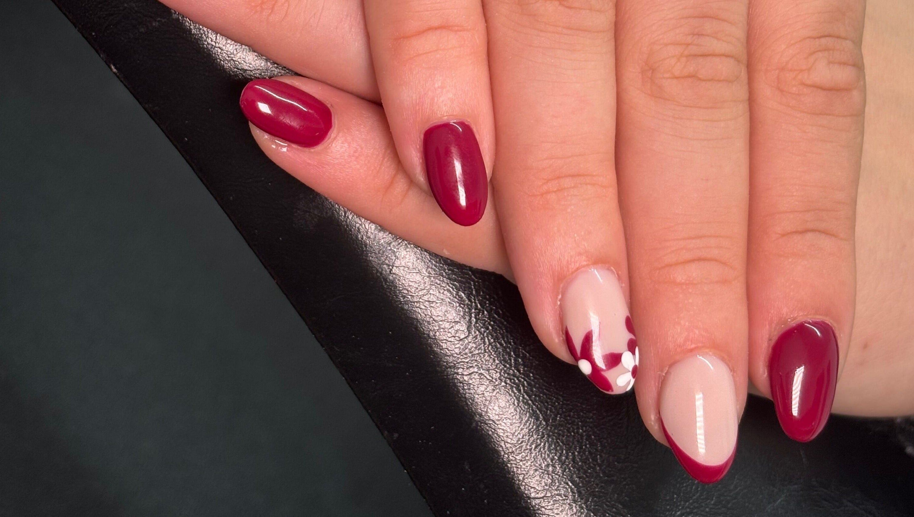 Elegant floral nail art in deep red at A.Luxebeauty, Sheffield, England, GB.
