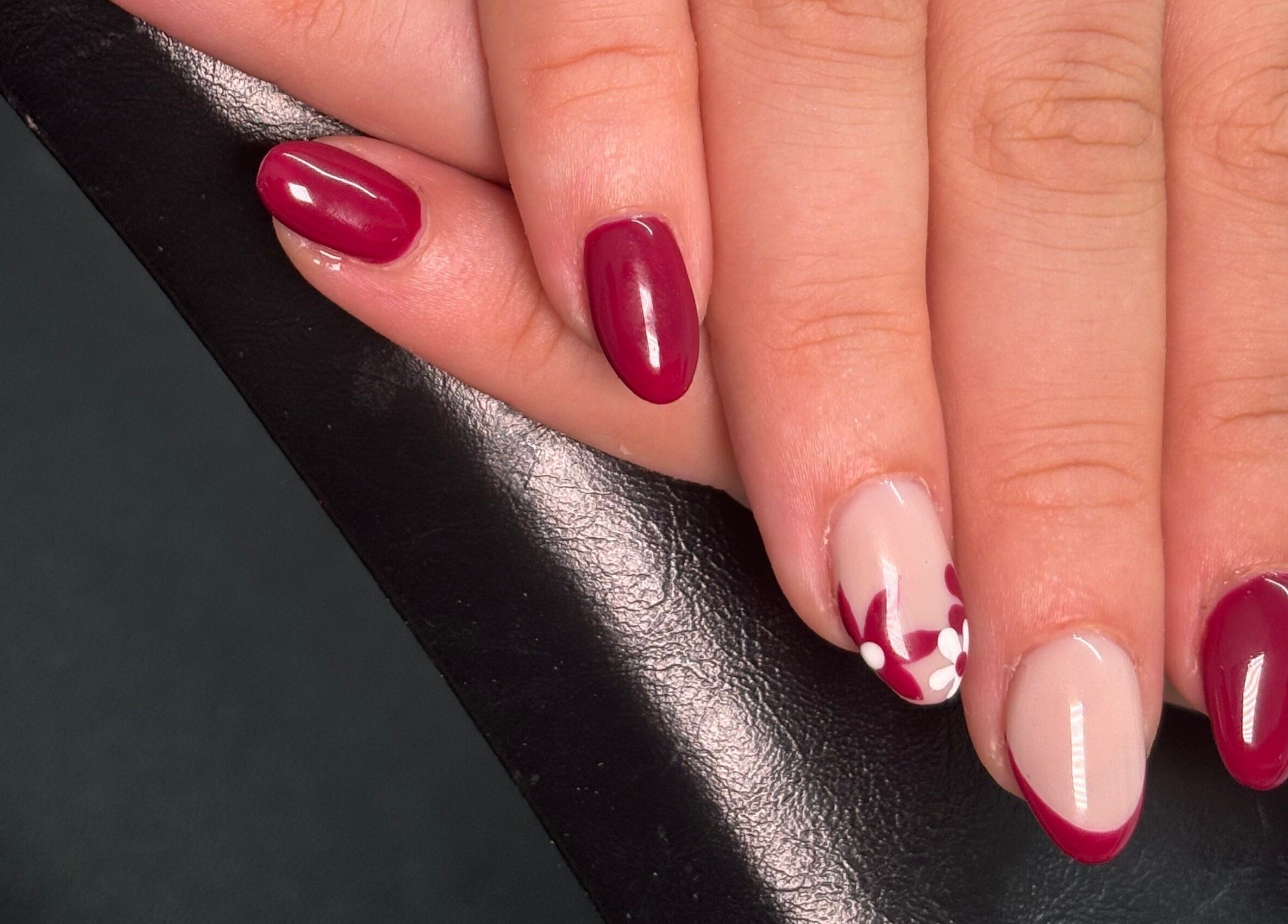 Elegant floral nail art in deep red at A.Luxebeauty, Sheffield, England, GB.