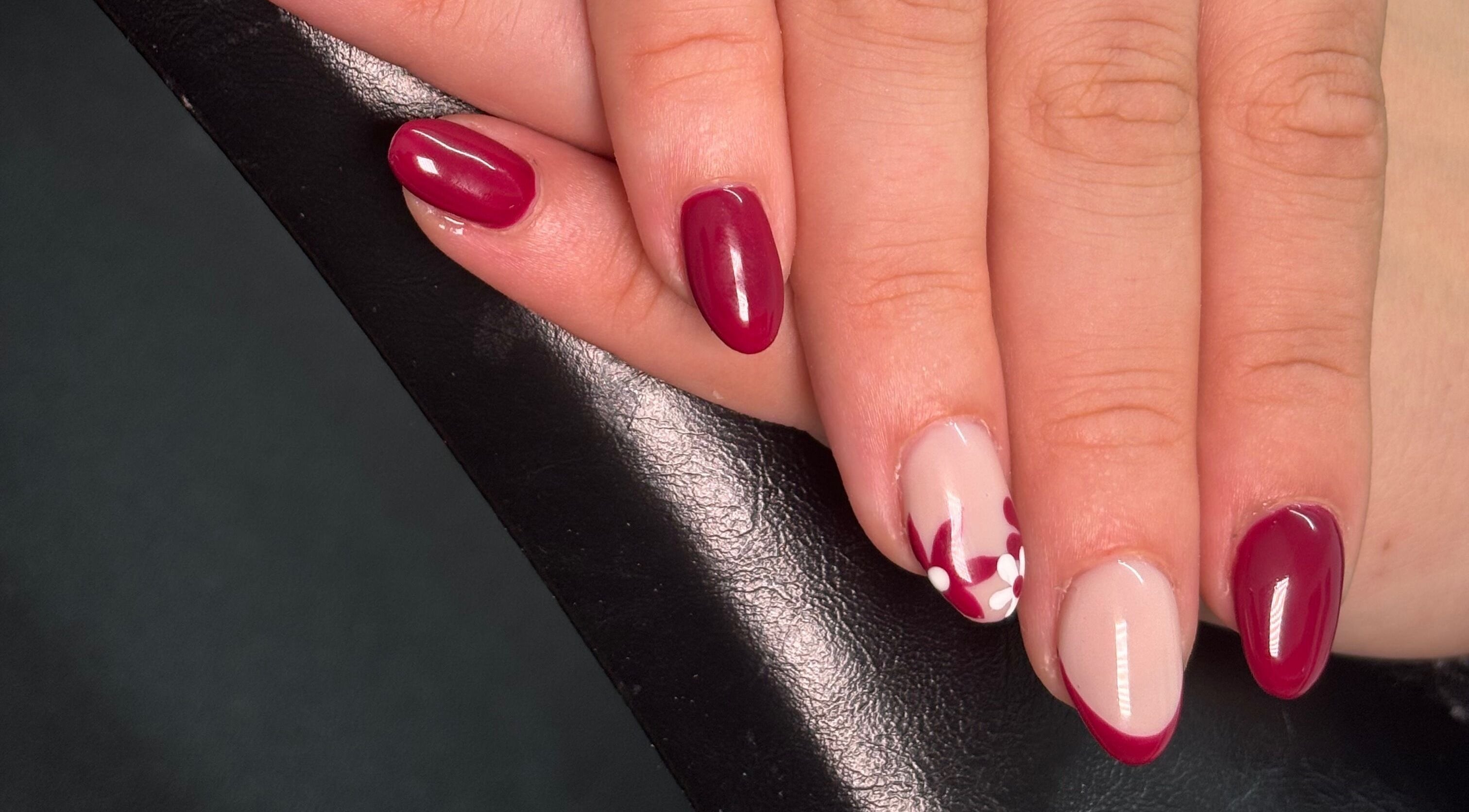 Elegant floral nail art in deep red at A.Luxebeauty, Sheffield, England, GB.