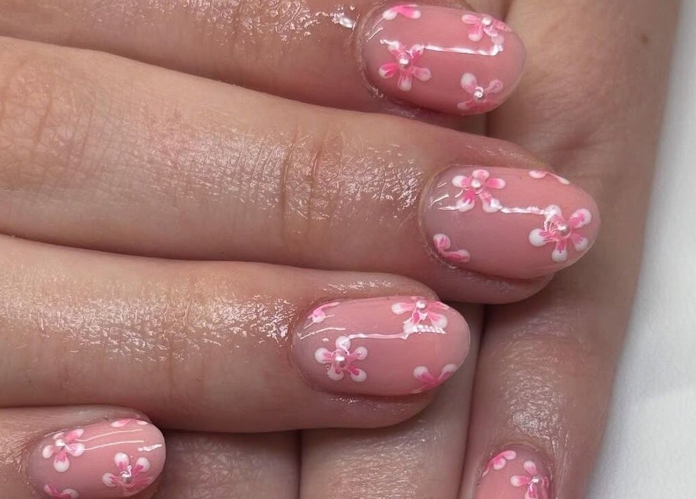 Elegant floral nail art at A.Luxebeauty, Sheffield, England, GB. Enhance style with delicate pink blooms.