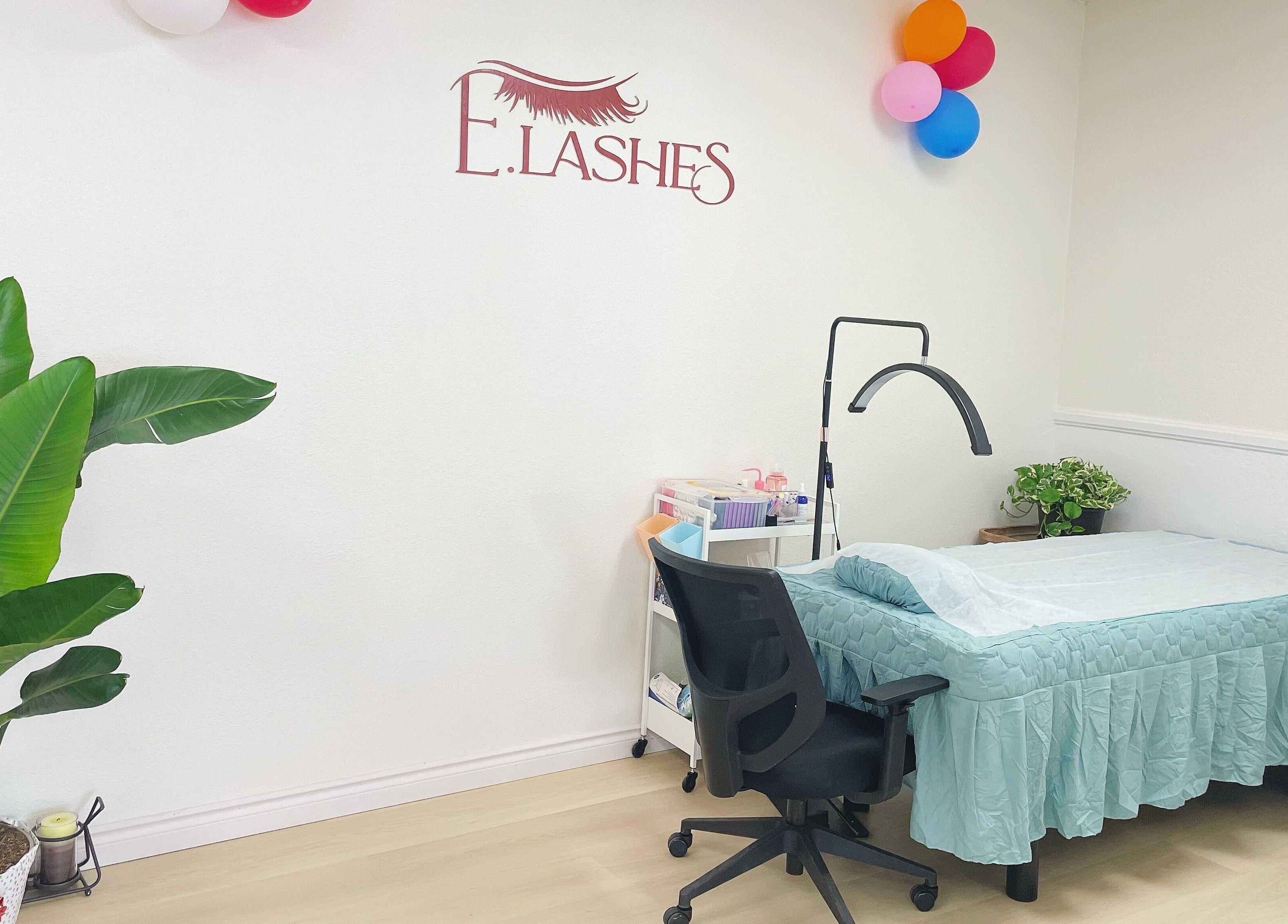 E.Lashes lash extension room in El Monte, California, US, with a treatment bed, chair, and decor.