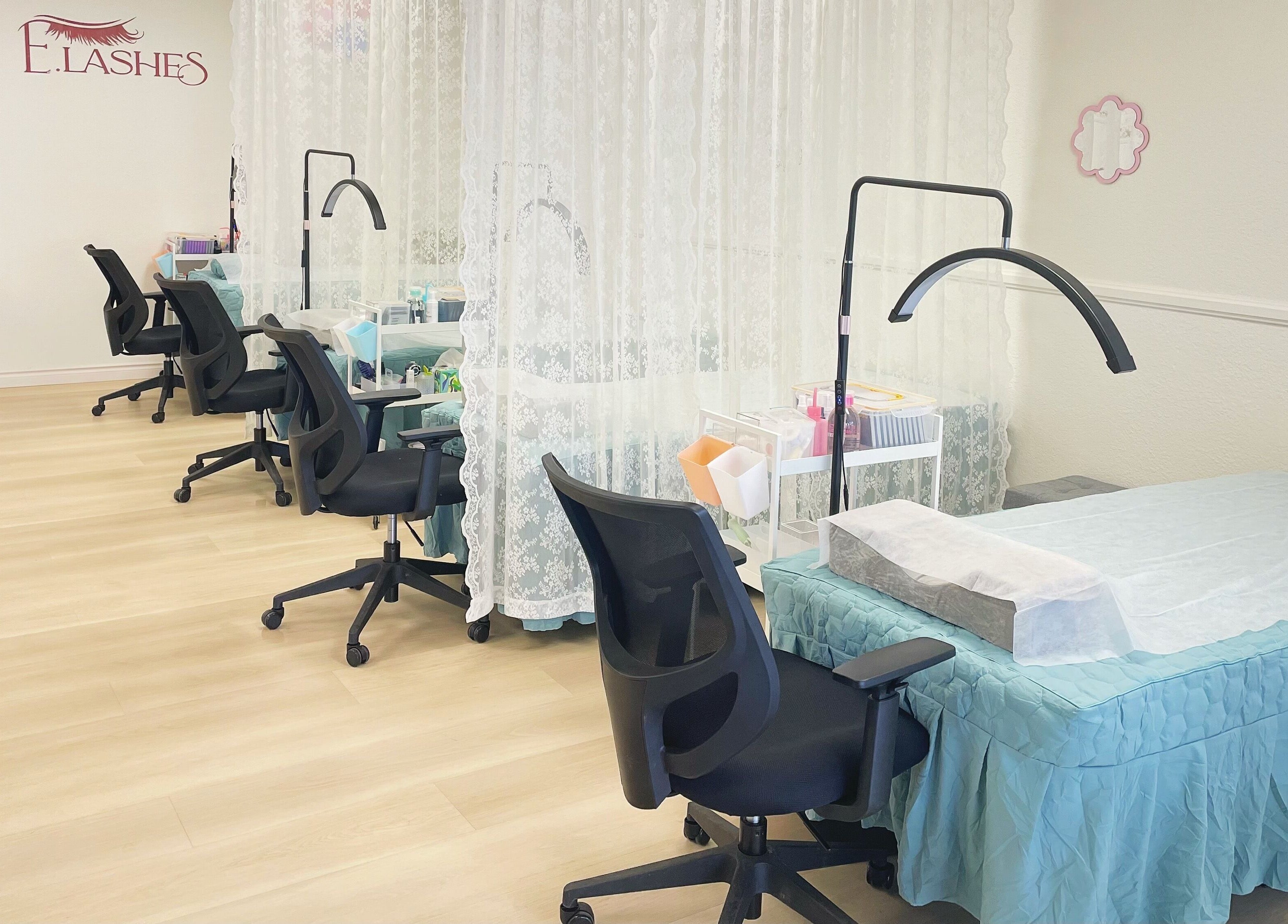 E.Lashes beauty setup with chairs and treatment beds in El Monte, California, US, offering a serene ambiance.