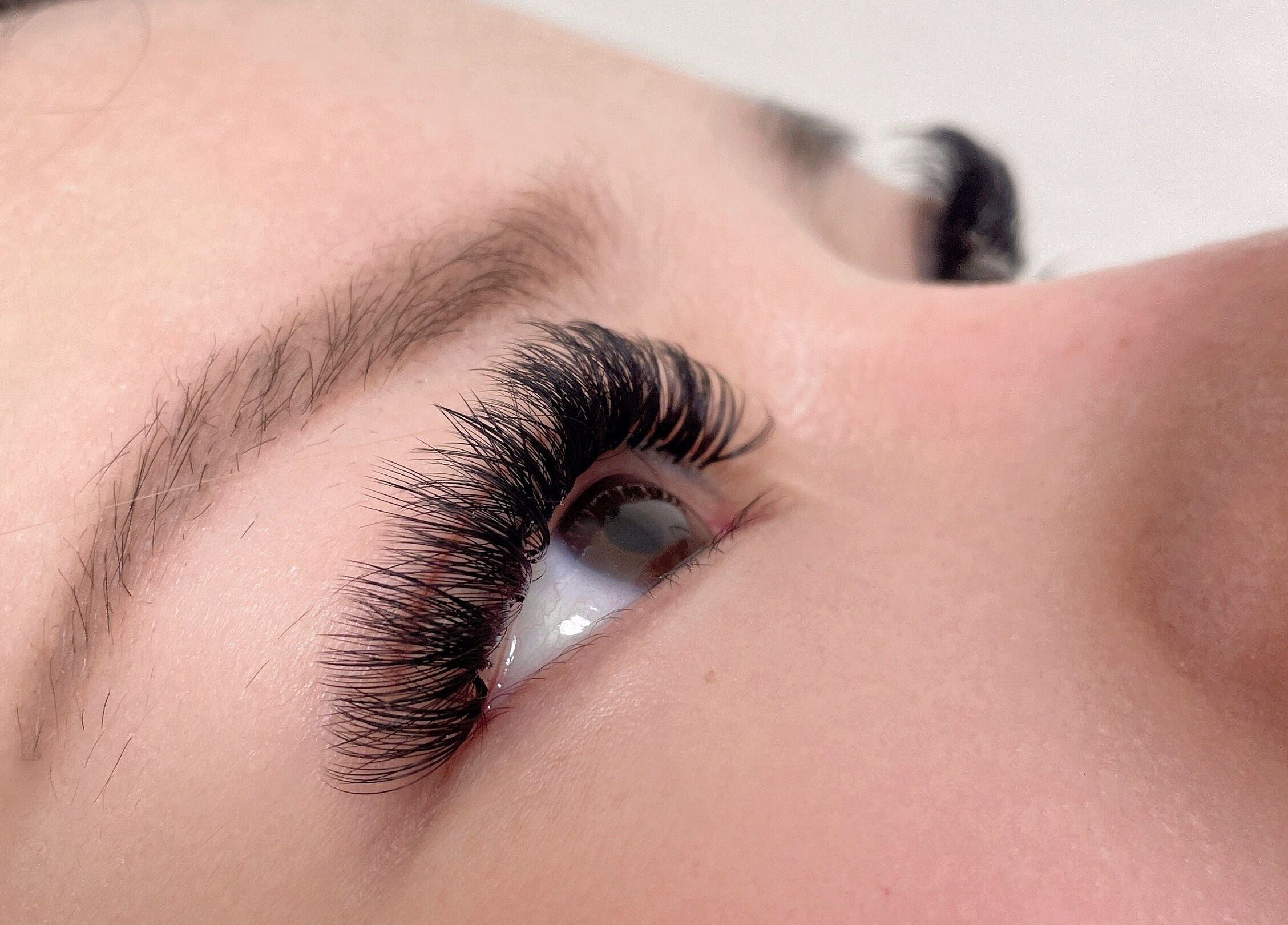 Closeup of eyelash extensions at E.Lashes, El Monte, California, US, showcasing volume and precision.