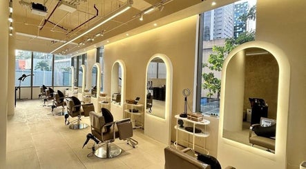 Chic interior of Purique Salon & Spa in Taguig, Metro Manila, PH featuring modern styling stations and mirrors.
